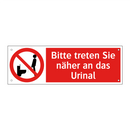 Bitte treten Sie näher an das Urinal