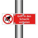 Griff in den Schacht verboten