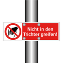 Nicht in den Trichter greifen!