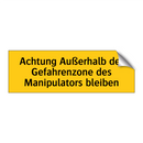 Achtung Außerhalb der Gefahrenzone des Manipulators bleiben