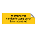 Warnung vor Handverletzung durch Zahnradantrieb