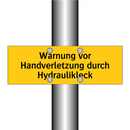 Warnung vor Handverletzung durch Hydraulikleck