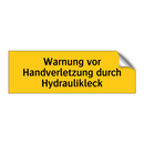 Warnung vor Handverletzung durch Hydraulikleck