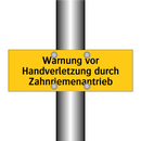 Warnung vor Handverletzung durch Zahnriemenantrieb