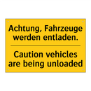 Achtung, Fahrzeuge werden entladen./.../ - Caution vehicles are being unloaded/.../