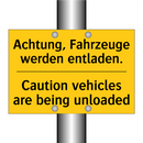 Achtung, Fahrzeuge werden entladen./.../ - Caution vehicles are being unloaded/.../