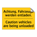 Achtung, Fahrzeuge werden entladen./.../ - Caution vehicles are being unloaded/.../