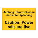 Achtung: Stromschienen sind unter /.../ - Caution: Power rails are live