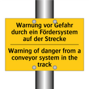 Warnung vor Gefahr durch ein Fördersystem /.../ - Warning of danger from a conveyor /.../