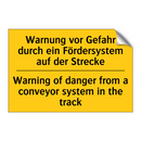 Warnung vor Gefahr durch ein Fördersystem /.../ - Warning of danger from a conveyor /.../
