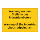 Warnung vor dem Greifarm des Industrieroboters/.../ - Warning of the industrial robot's /.../