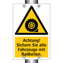Achtung! Sichern Sie alle Fahrzeuge mit Radkeilen.