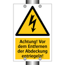 Achtung! Vor dem Entfernen der Abdeckung entriegeln!