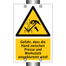 Gefahr, dass die Hand zwischen Presse und Werkstück eingeklemmt wird!