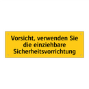 Vorsicht, verwenden Sie die einziehbare Sicherheitsvorrichtung