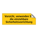 Vorsicht, verwenden Sie die einziehbare Sicherheitsvorrichtung