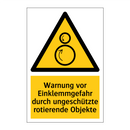 Warnung vor Einklemmgefahr durch ungeschützte rotierende Objekte